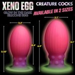 XR Brands Creature Cocks silikonowe jajko XL świecące w ciemności, żebrowane, multikolor